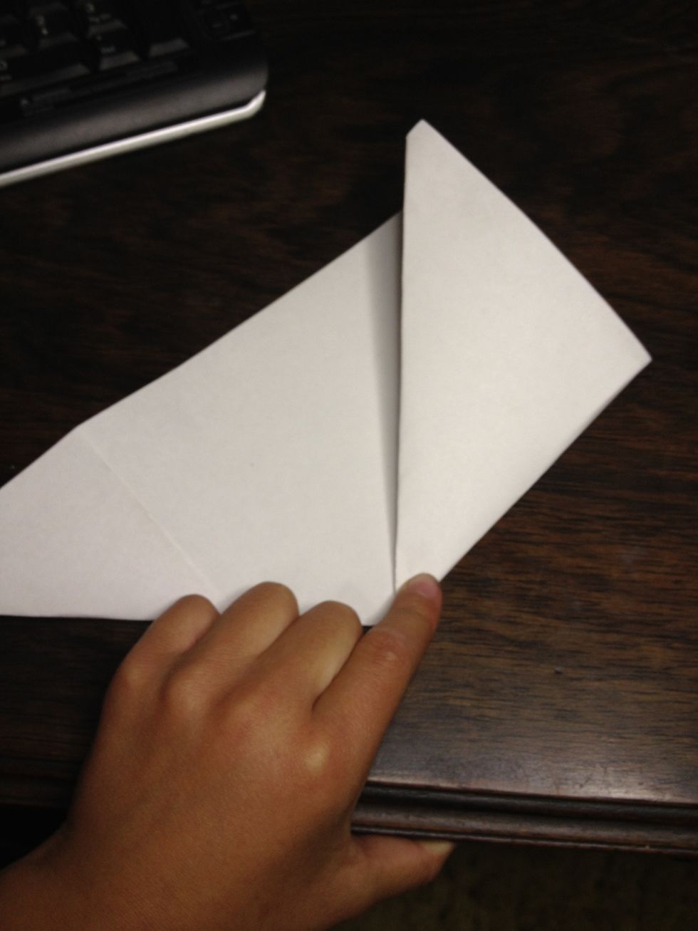 Fold up one side then the other