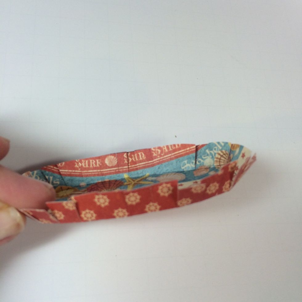 Fold up the cut flaps. This forms the base of the tote bag.