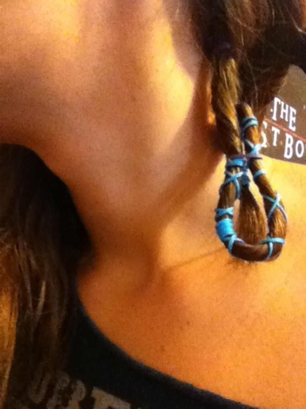 Fold up your dread and secure it with a rubber band