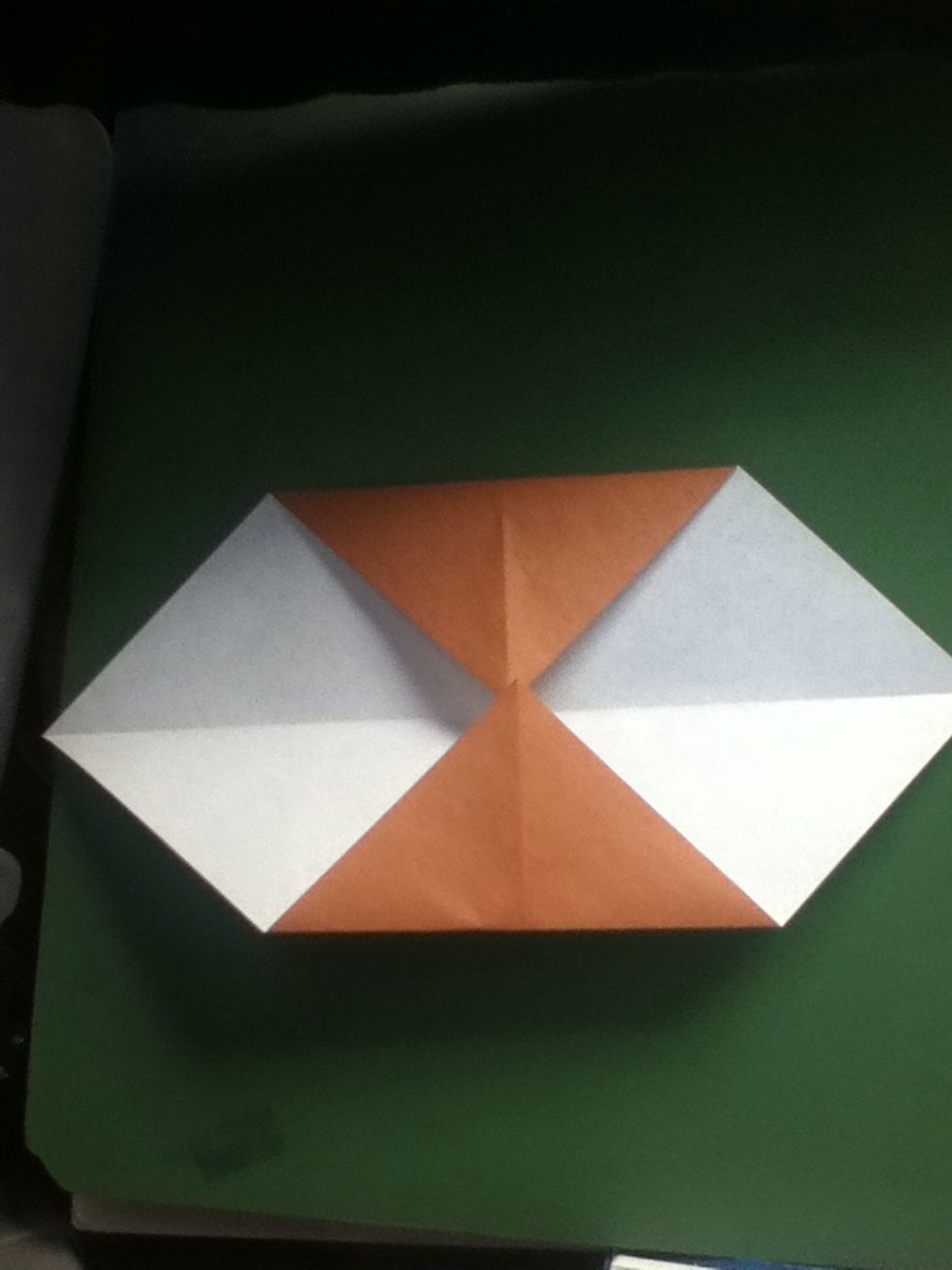Fold upper and lower corners to the center