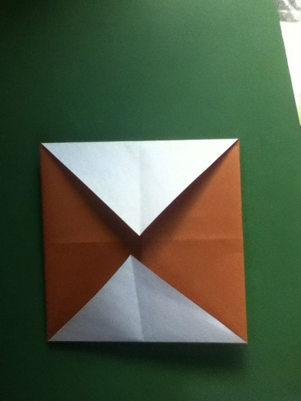 Fold upper and lower corners to the center