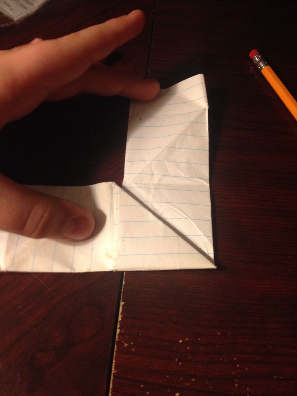 Fold upwards at the top of the triangle
