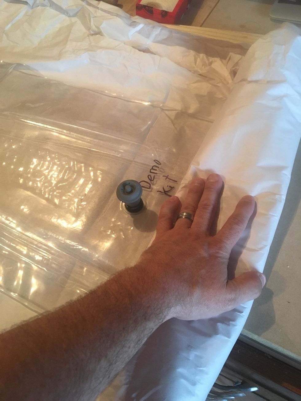 Fold vacuum bag toward valve.