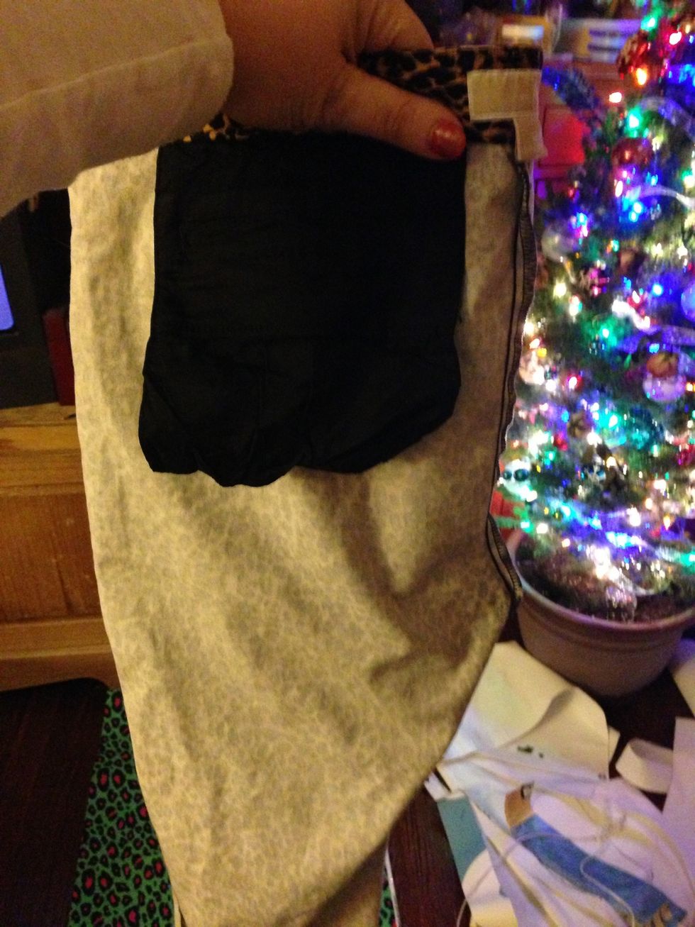 Fold well fitting jeans showing the curve of the back of the leg.