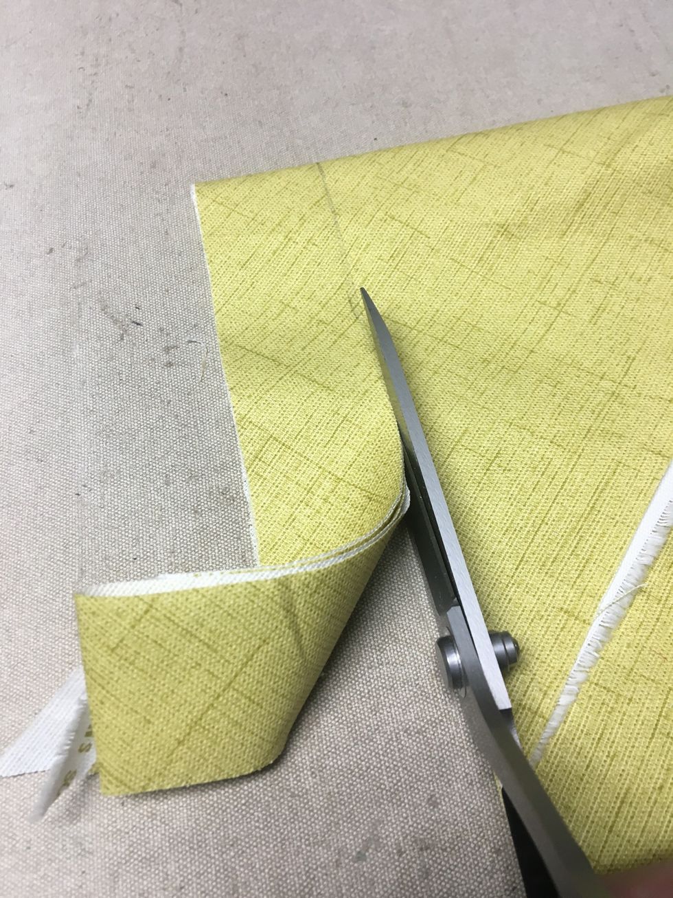 Fold your banding fabric on the diagonal and cut 1 1/2" strips. Cut enough to go around your basket plus 8 - 9" ties. To see how to cut bias banding please visit our website https://bit.ly/2w48YCH