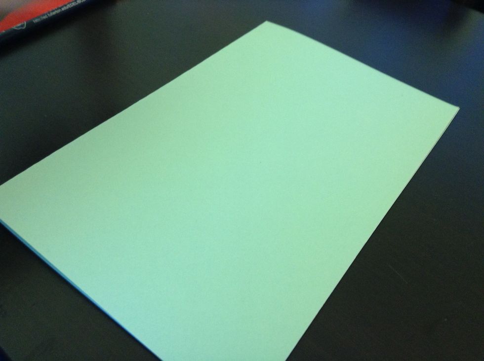 Fold your card stock paper in half like this.