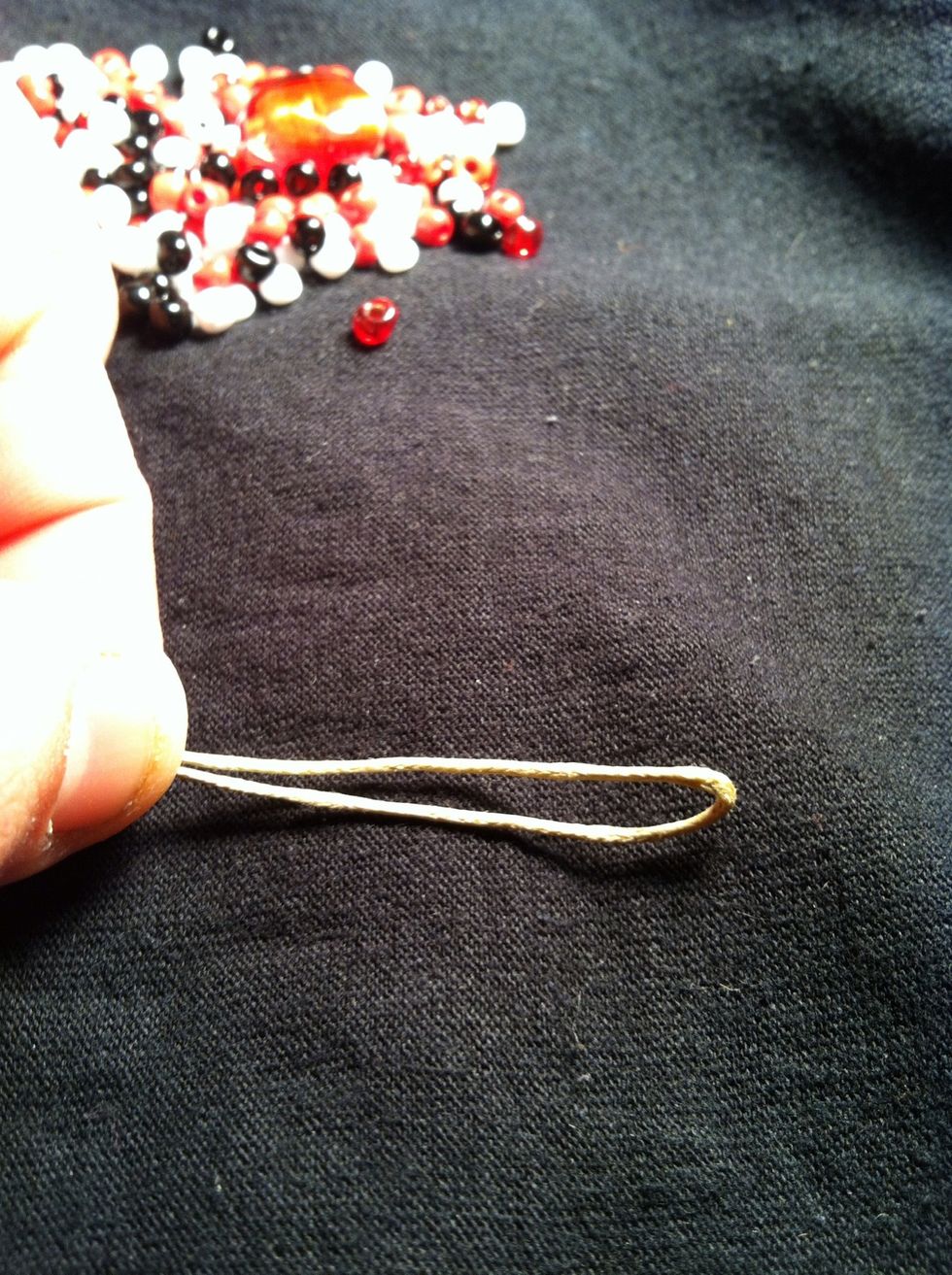 Fold your cord in half and make a loop (the picture cut off the end of the loop.)