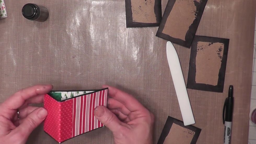 Fold your cover shut, you are now ready to create and add pocket pages made from the remaining four toilet paper tubes.