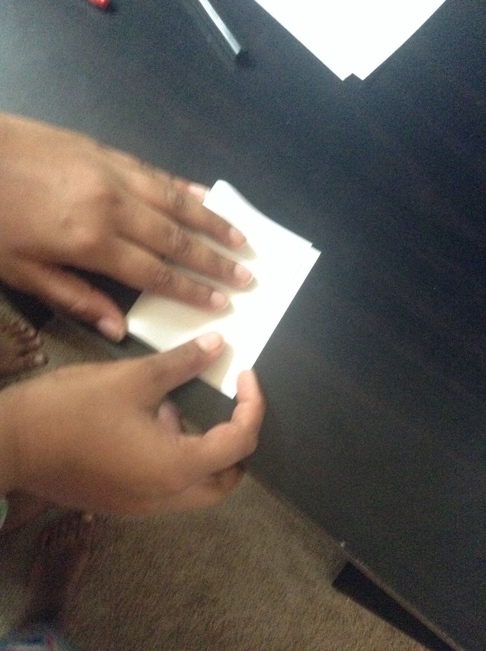 Fold your index cards in half. When you fold make sure you use your nails to make a crease.