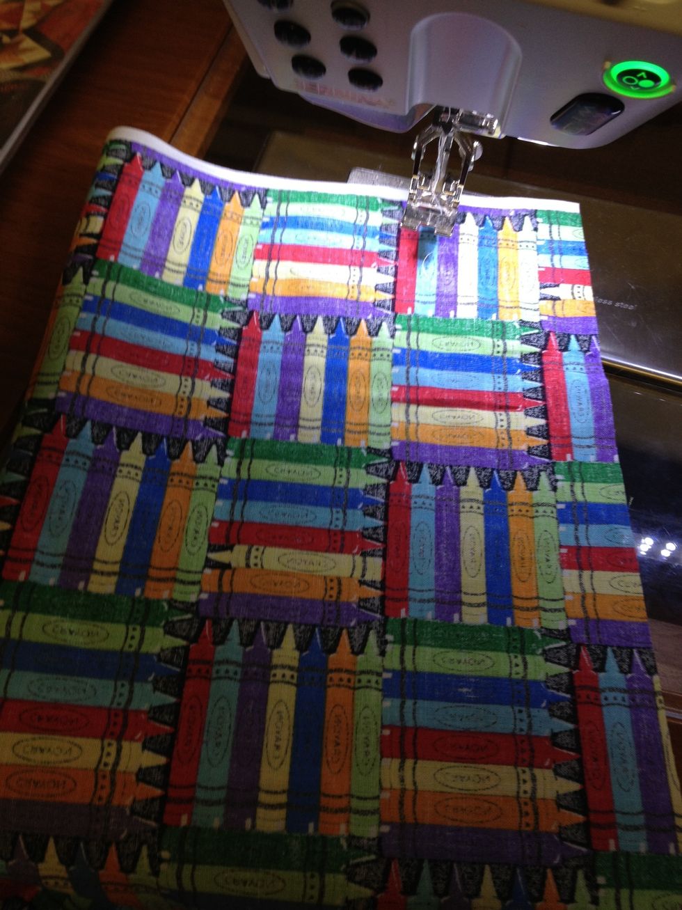Fold your long strip in half right sides together.  Sew  along the long edge.  1/2 inch seam alliwance.  Leave the ends open