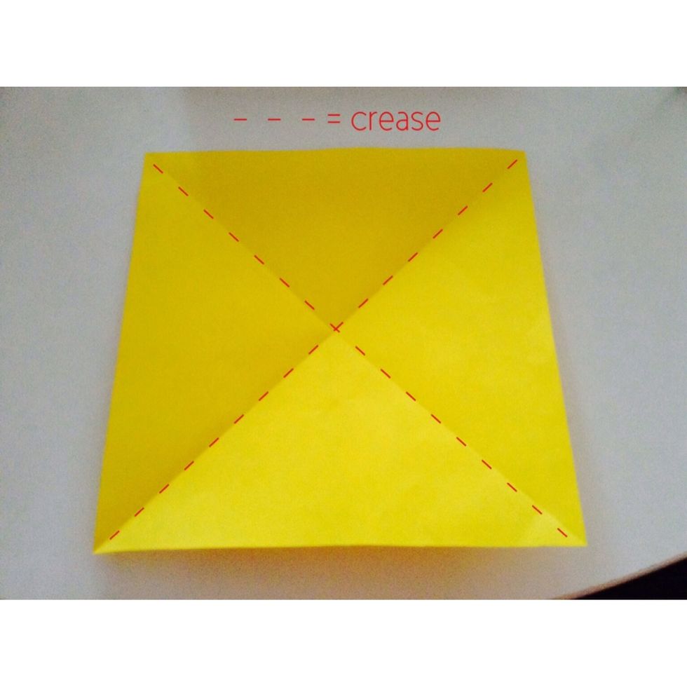 Fold your piece of paper diagonally to look like the picture shown.