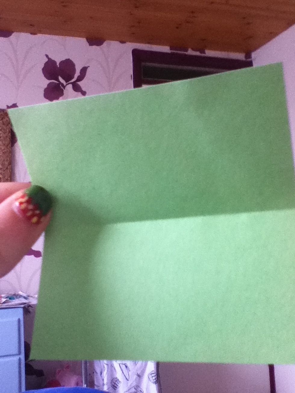 Fold your piece of paper in half, and unfold it again so you are left with a crease down the middle.