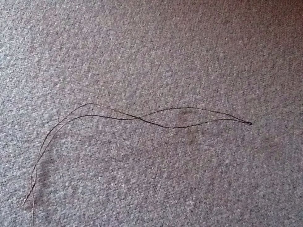 Fold your string in half it needs to be long enough to go from the top of your Nisse to the bottom + a little extra for hanging up and making a knot