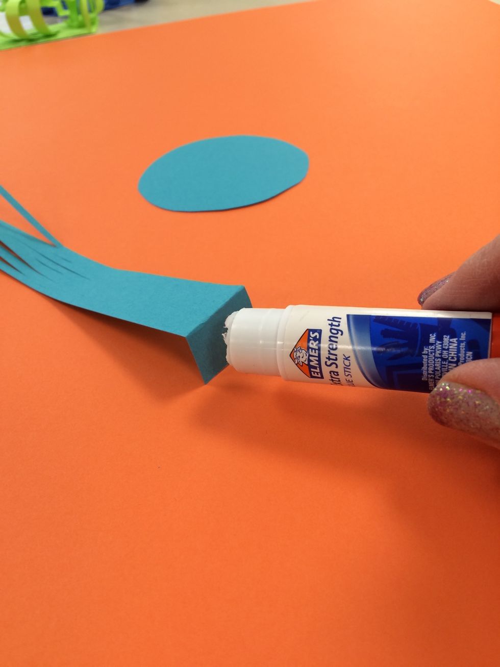 Folding a tab at the bottom of some shapes is necessary to help then attach to the base. Remember to use an extra strength glue stick. I use acid free.