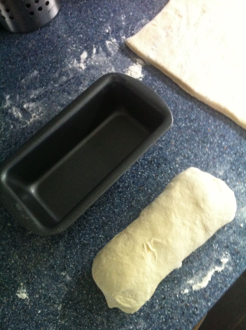 Folding the ends over to stretch in to a smooth shape.