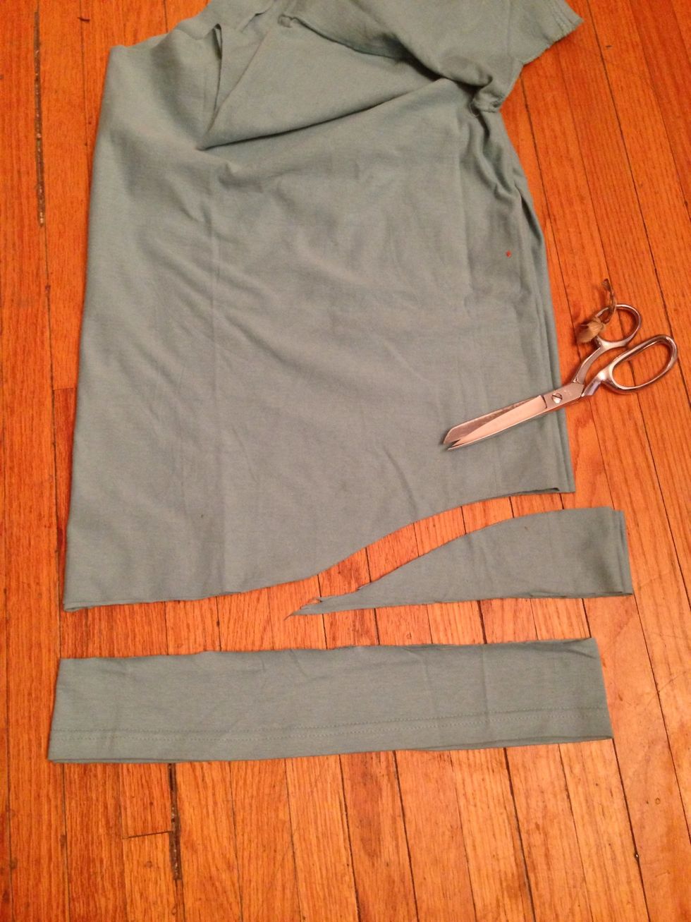 Follow the photo to take about 3" off the sides. Cut straight in for a very short way, then curve down to the halfway point on the folded dress.