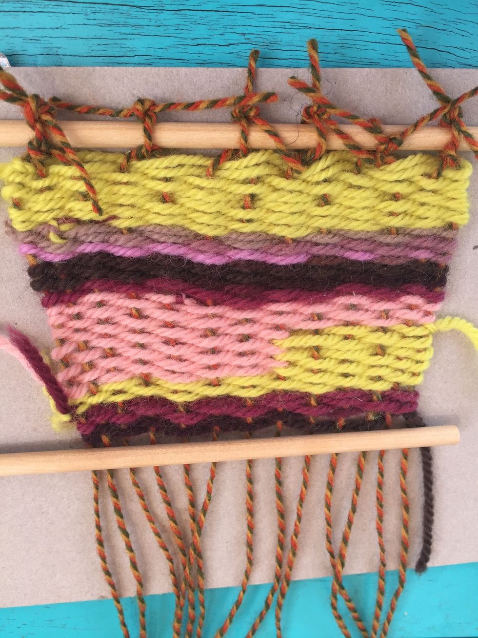 Follow the same knotting technique with the bottom of the weaving.