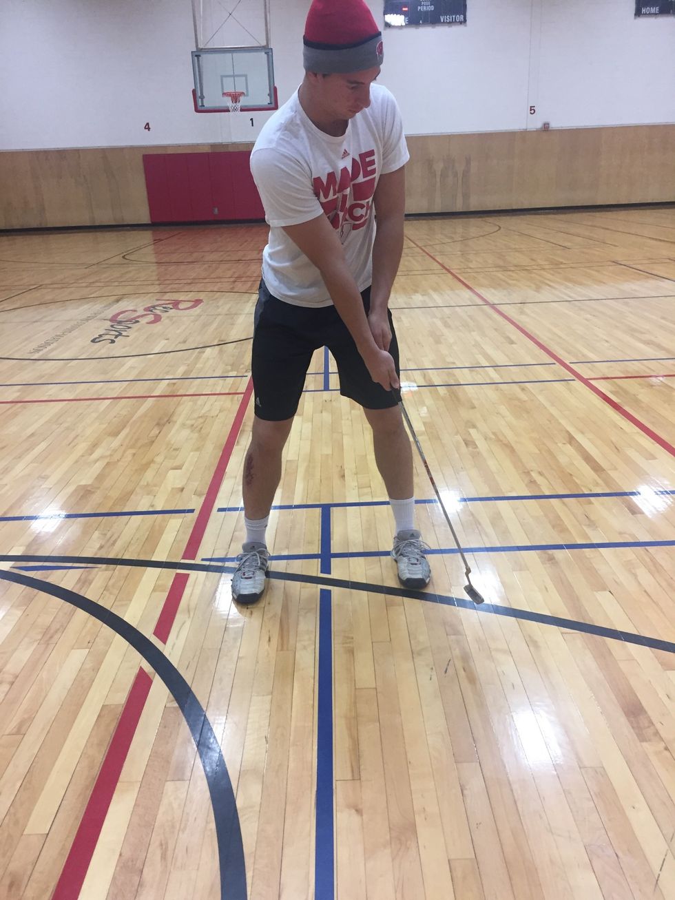 Follow through toward hole or target line, imagine the ball going into the cup