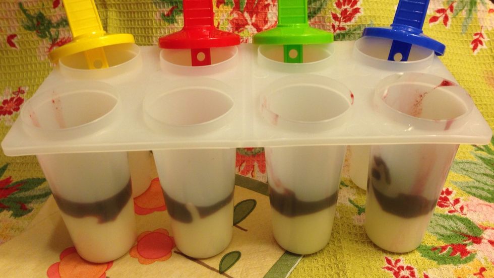 Follow-up with a layer of the blackberry mixture. Continue layering until all molds are evenly filled. If you are so inclined, drag a knife or fork through the mixtures to create a swirl effect.