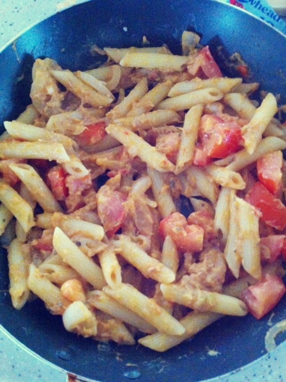 Followed by tomato cubes & pasta. Sprinkle some oregano leaves & mix well before serving.