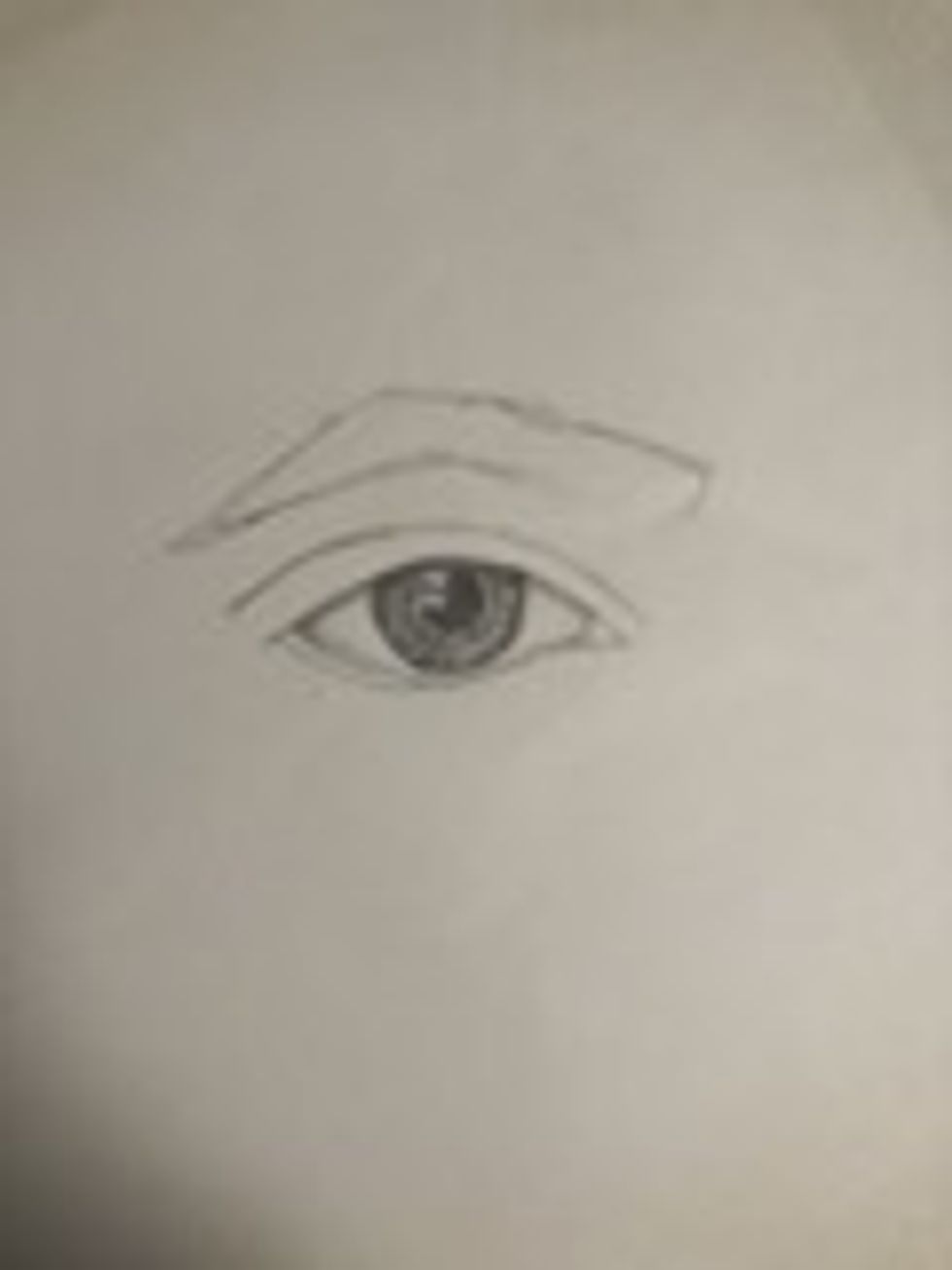Following the shadow over the iris, follow the shadow along the eyelid on the white of the eye.