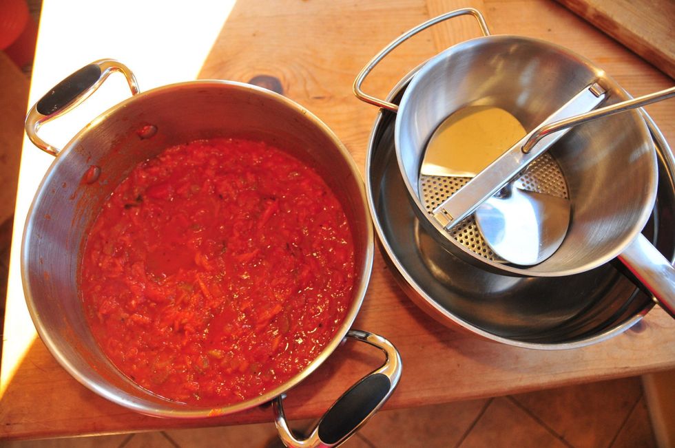 Food-mill time. If you don't have a food mill you can cautiously use a blender.  But food mills break down the chunk with care and ease, making the perfect texture for the sauce.
