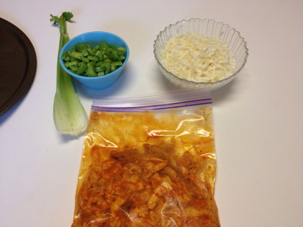 For 2 pizzas, put about 2 cups of chopped chicken, place in zip bag and pour enough sauce to cover chicken to marinade. Dice celery.