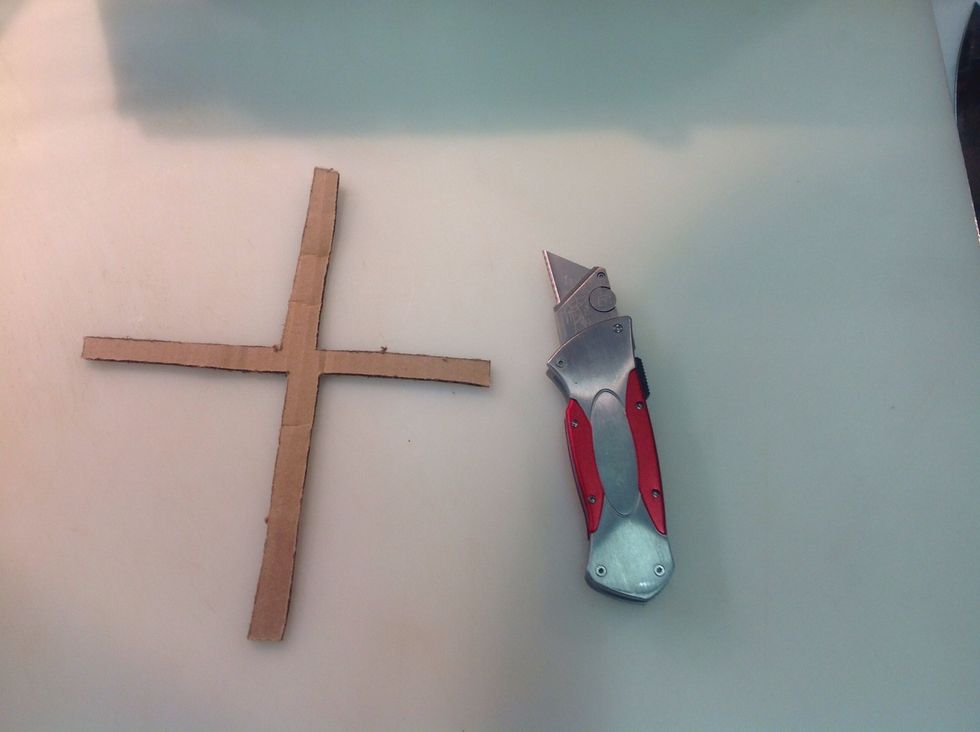 For a decorative option, cut a cross out of cardboard or parchment.