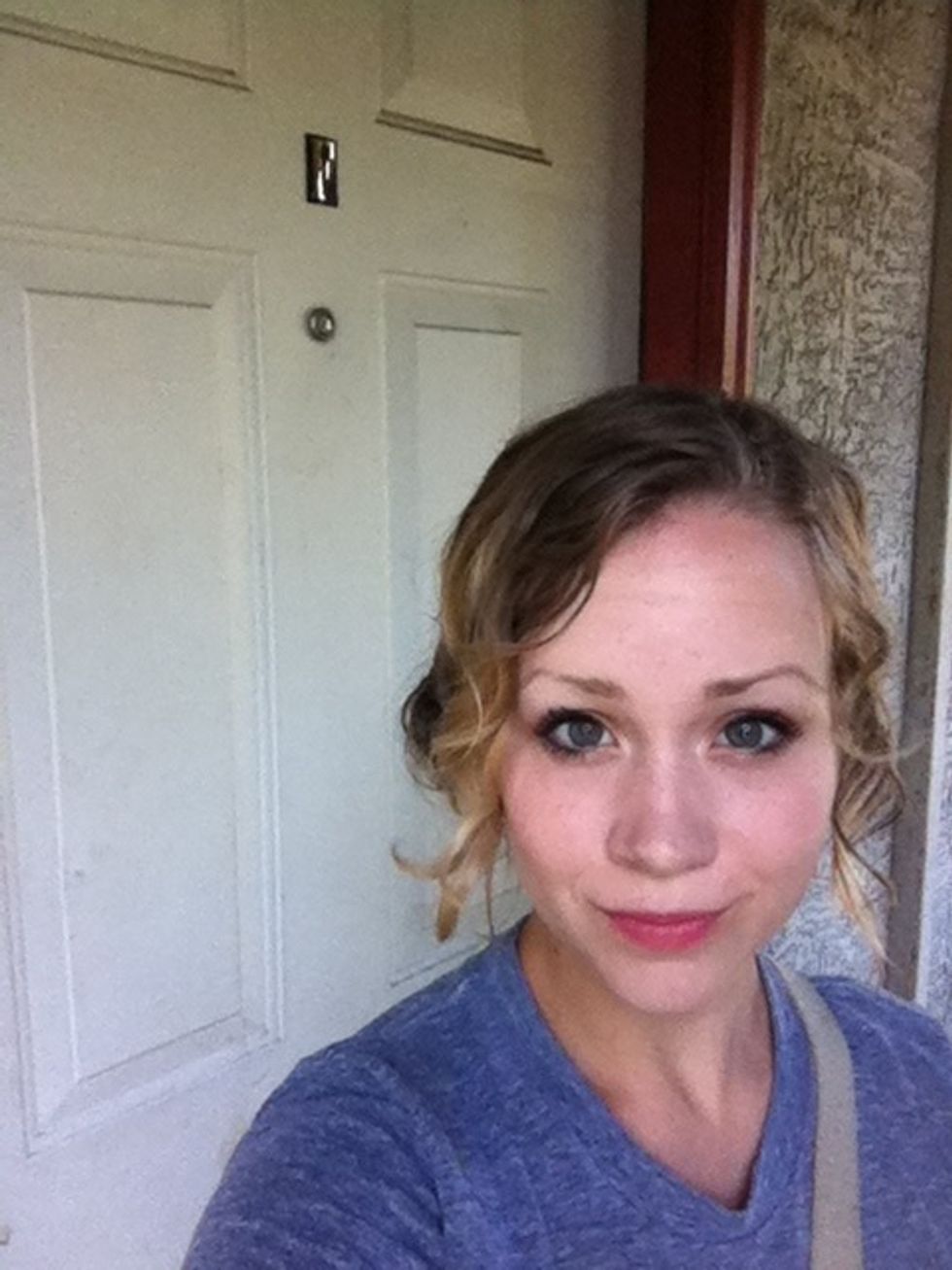 For a genuine look, just take a picture somewhere it's natural for you to be! In this one I'm standing outside my apartment.