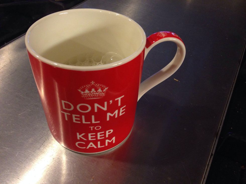 For a latte, pour approximately 1/2 cup milk into a microwave safe mug and heat on high for 1 minute.