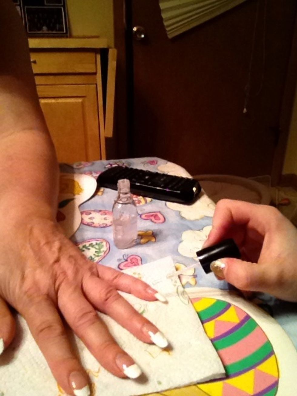 For a more shiny look, open the clear polish,once again, and paint the whole nail clear, do so evenly and keep the brush on your nails only.