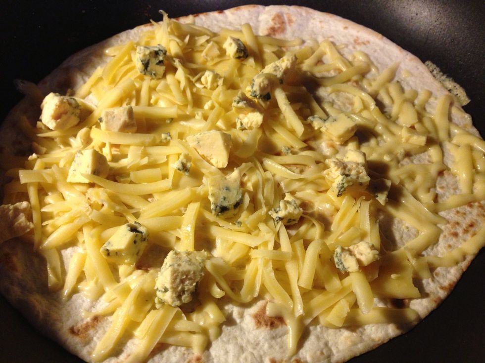 For a vegetarian option add different cheeses in the tortilla. Here I use eidam, gouda and blue cheese.