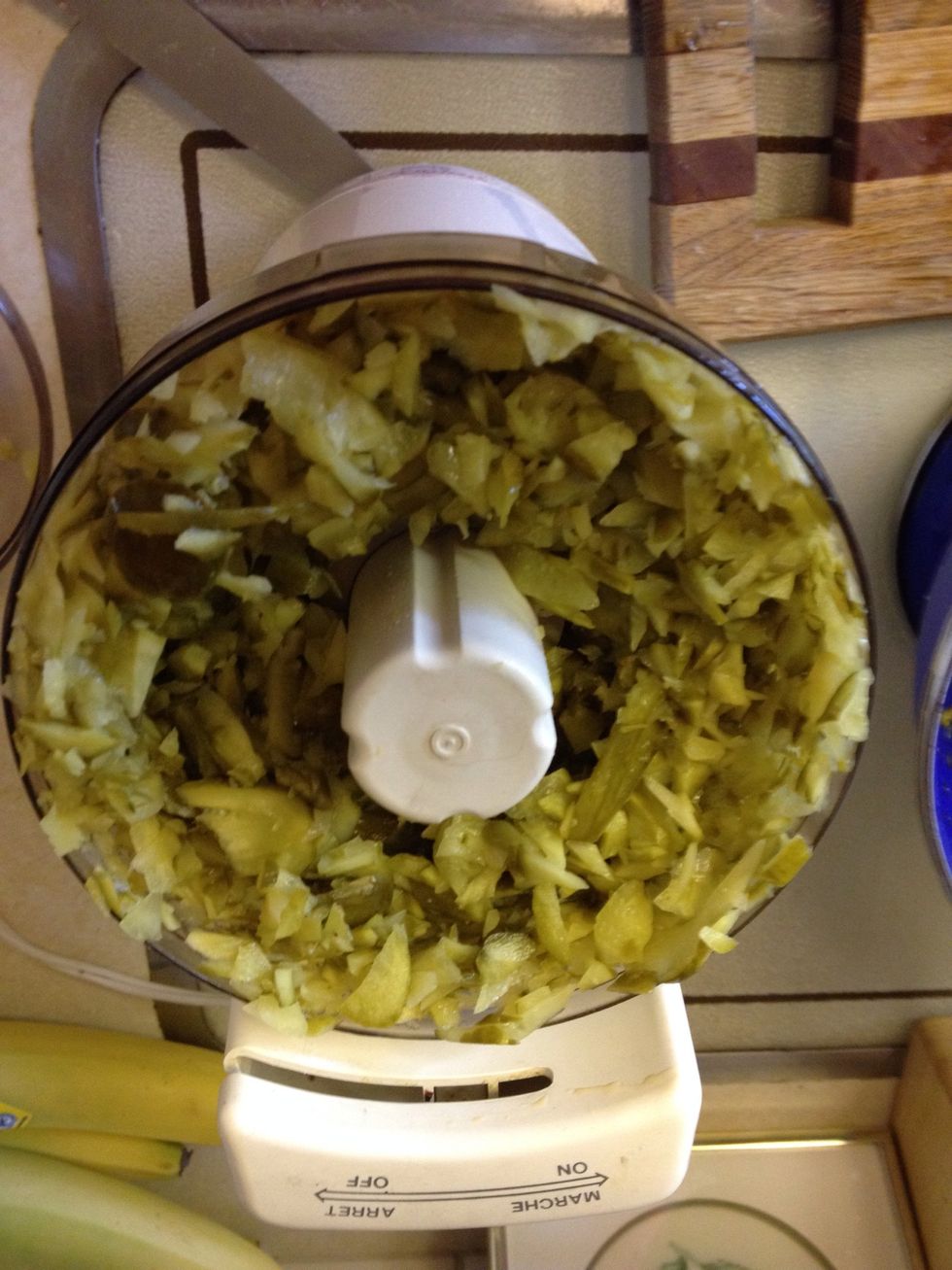For all the ingredients in the cans and bottles, use the chopper. Saves time. Here are the pickles. Don't chop too much. Can have some chunks.