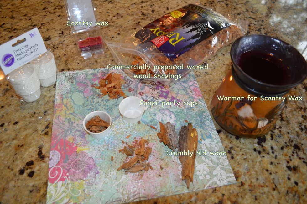 For alternatives, let's compare: 1--plain crumbled wood; 2--purchased 'fire starter' shavings; & 3--home-made crumbled wood soaked with old melted Scentsy wax. First, put the wood in the party cup.
