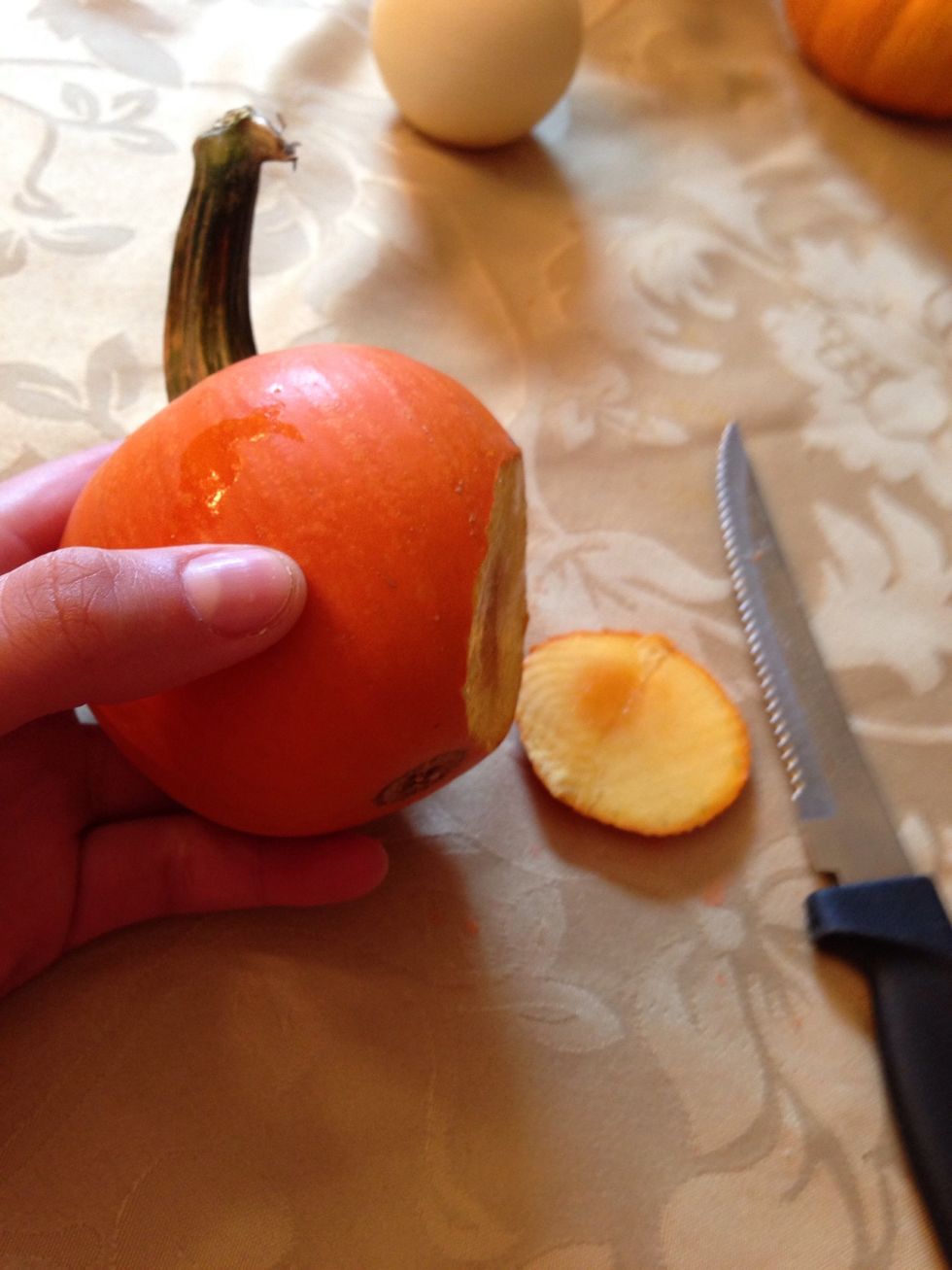 For angled candle cut the side of the pumpkin so it sits flat.