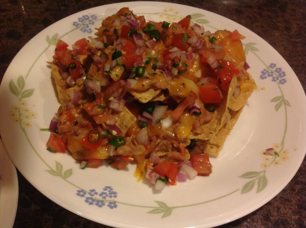 For cool presentation, add the next layer of chips, and repeat with the salsa. You will have a big mountain of nachos for everyone to dig into!
