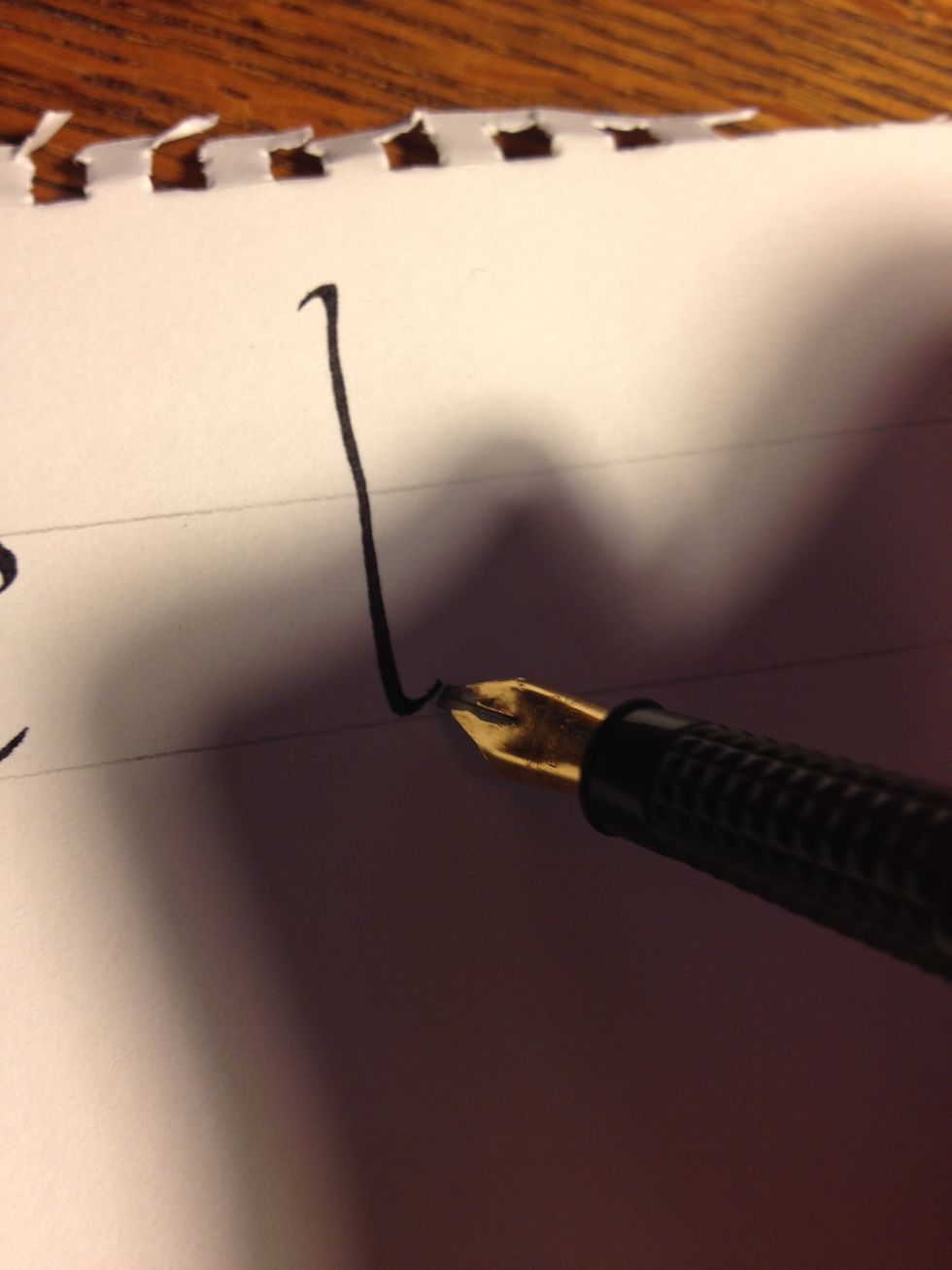 For "d", start out making the same stroke you would make to start "b", then make an upward tic at the bottom.