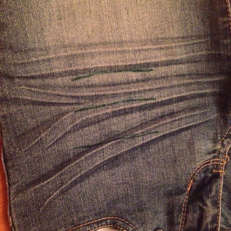 For distressing your shorts, draw 3 ,or more, lines