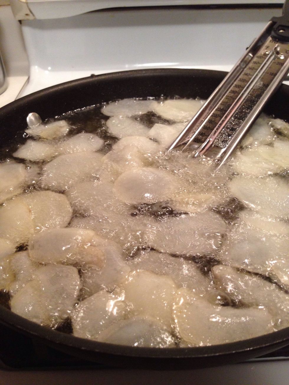 For each batch, put in just enough so that the chips float in one good layer. You don't want to overcrowd the oil in each batch.