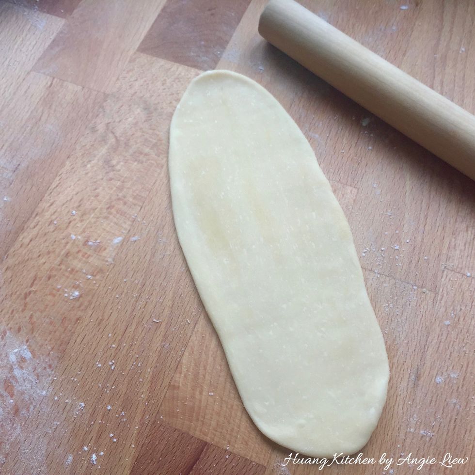 For each of the combined dough, flatten and roll out on a lightly floured surface into a long rectangular shape with a rolling pin.