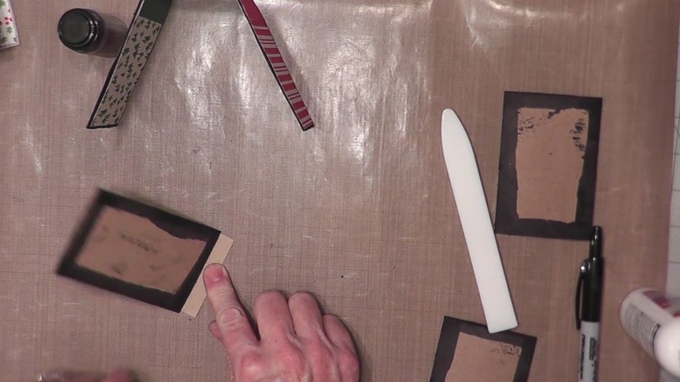 For each page, take one of the scored hinges and apply glue to the front and back on one 1/2" section and insert the glued section into one end of a tube, burnish to seal. You will have a 1/2" flap.