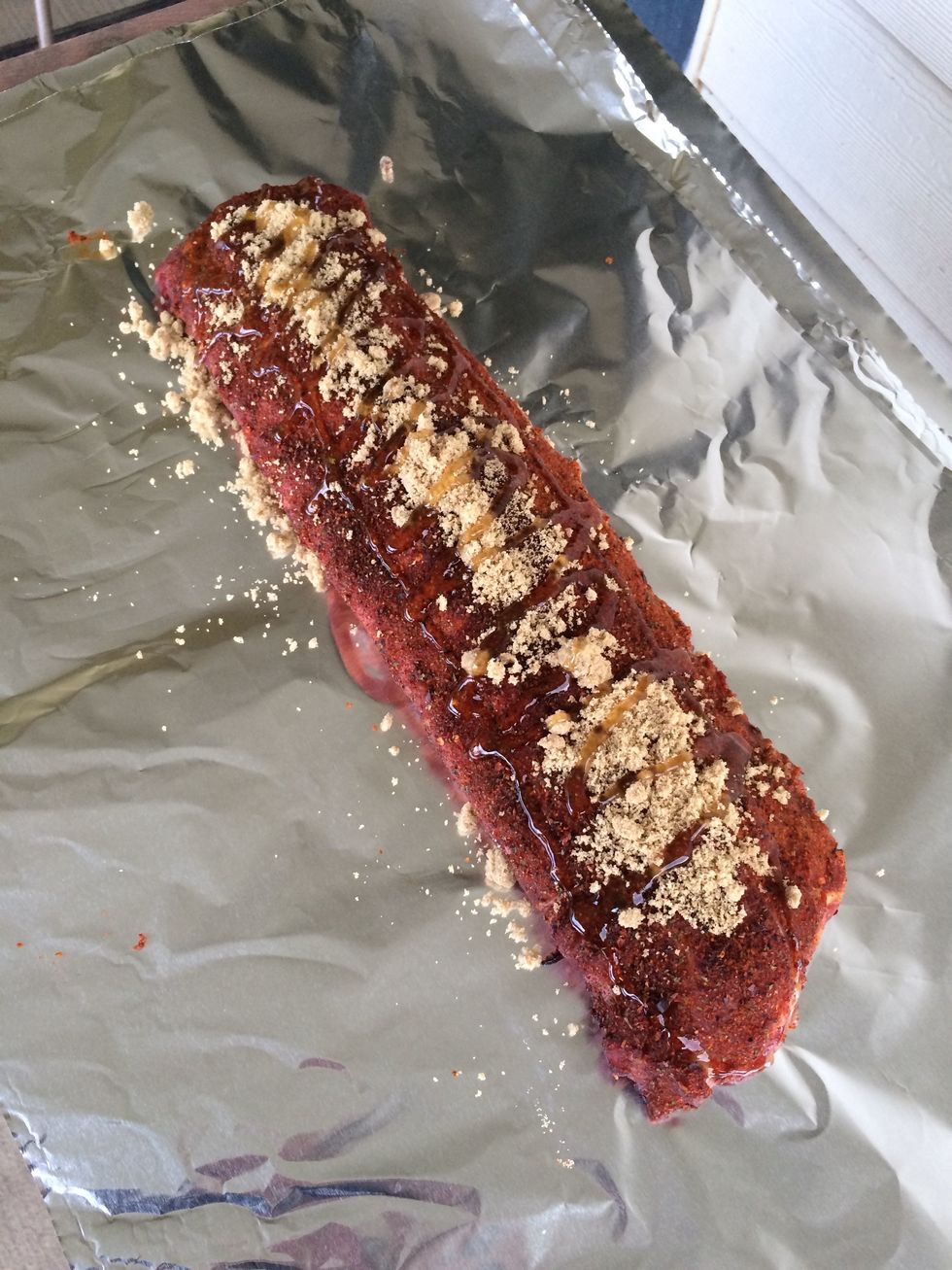 For each rack being smoked: Place a rack on a sheet of foil, put 1/4 cup brown sugar and drizzle honey over the entire thing. Don't like honey? Try maple syrup. Then wrap it up. Leave one end open and