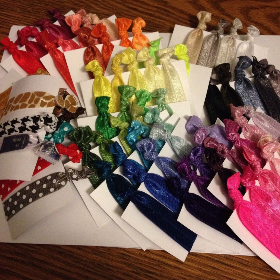 For easy storage, cut pieces of card stock into rectangles and slide the hairties on in a pretty color scheme. This also works great if you're giving them as a gift or trying to sell them. Good luck!