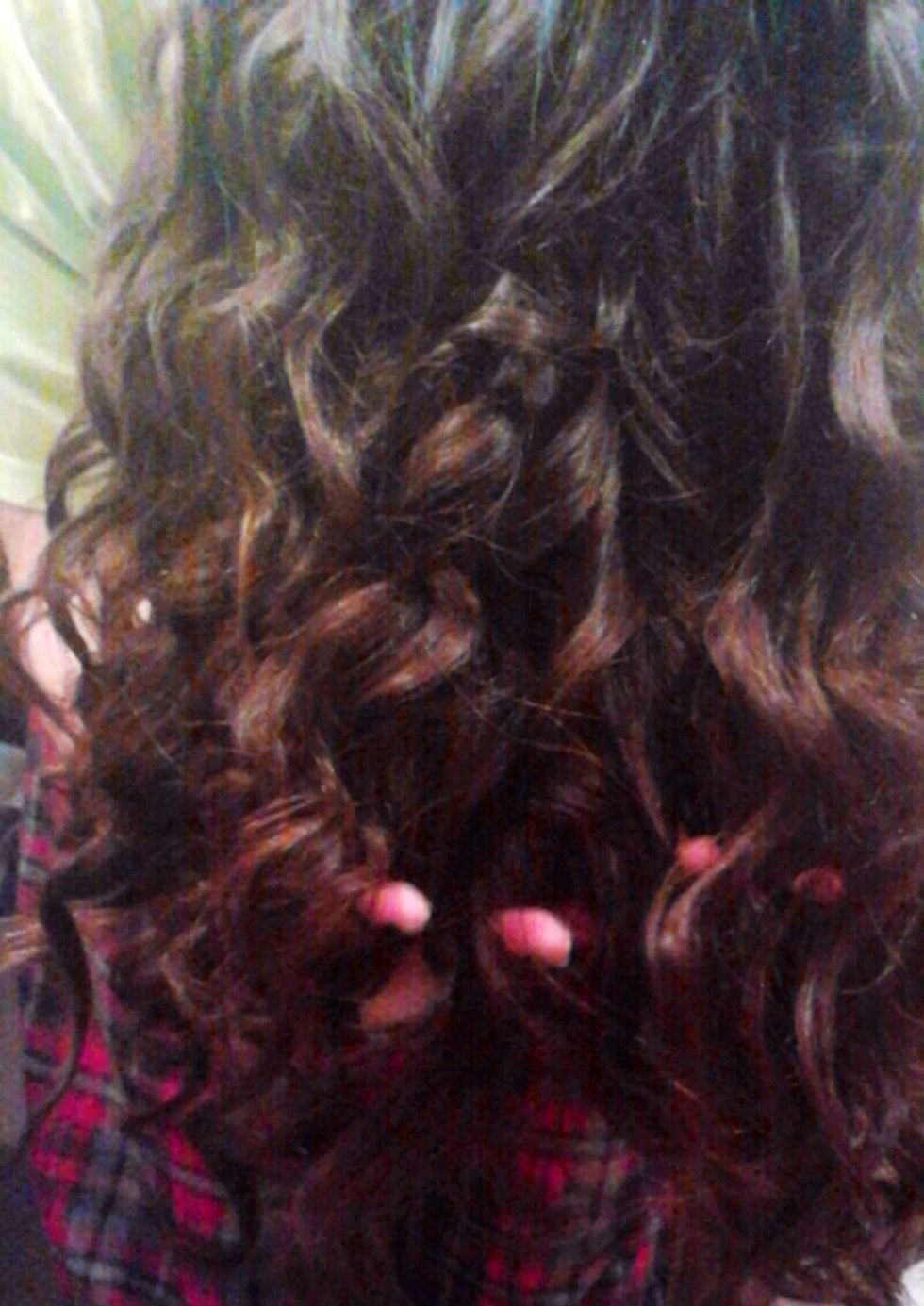 For extra volume, run your fingers through the curls with your hair still flipped over. Don't over do it, you're just separating a few curls. Spray with hairspray.