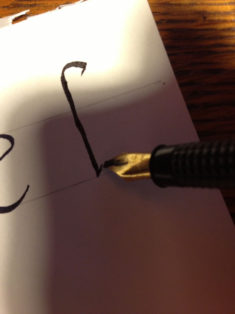 For "f", make a tic well above the top line, then draw a cane with another tic at the bottom.