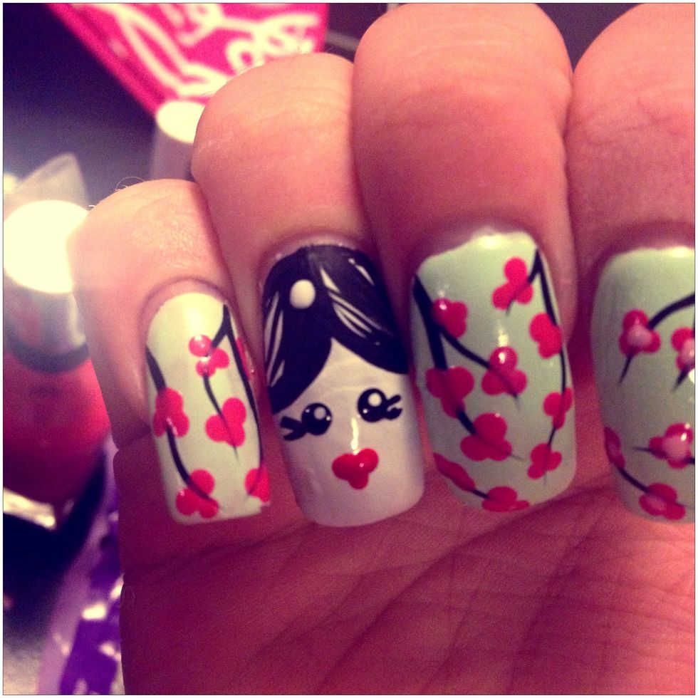 For her hair flower add a white dot Because the colors won't bounce over the black as well.