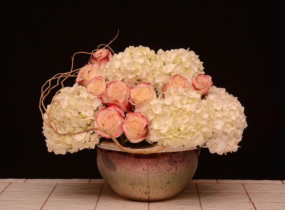 For interest let's insert a few pieces of curly willow\u2026.. Here is one.