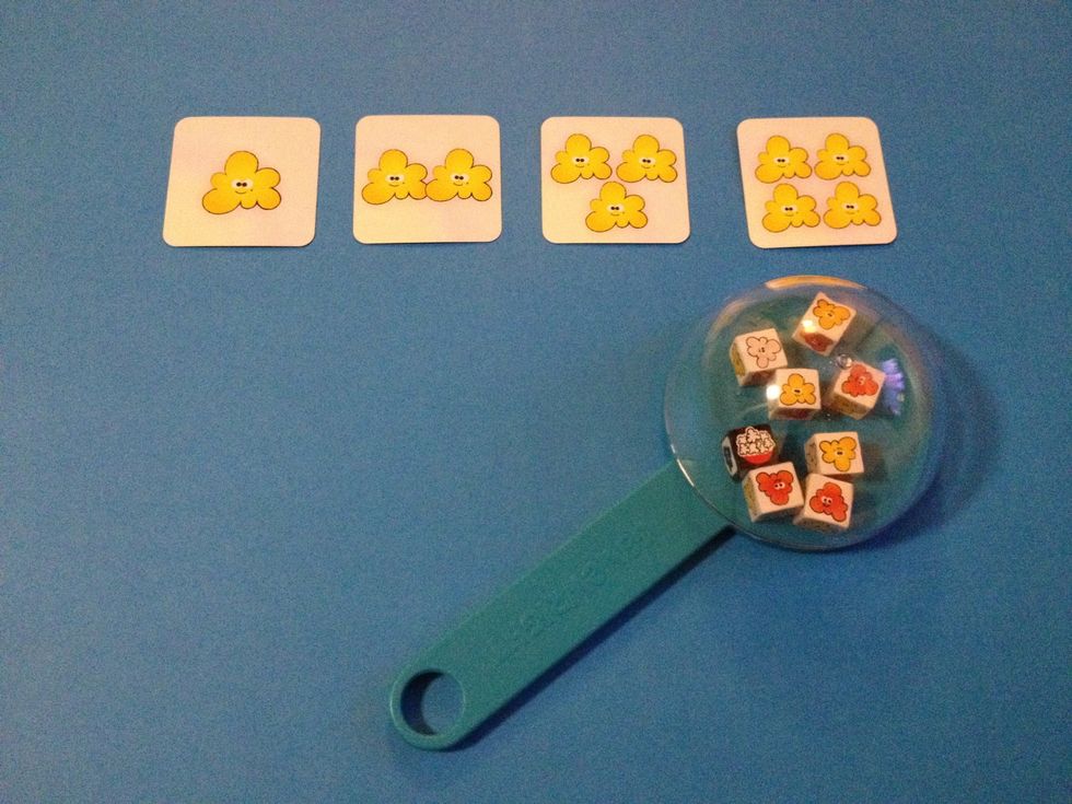 For learners who struggle with scanning, introduce a field of 4 of the same color of popcorn. The learner shakes the popper, counts up the yellow popcorn, then matches that number to the correct card.