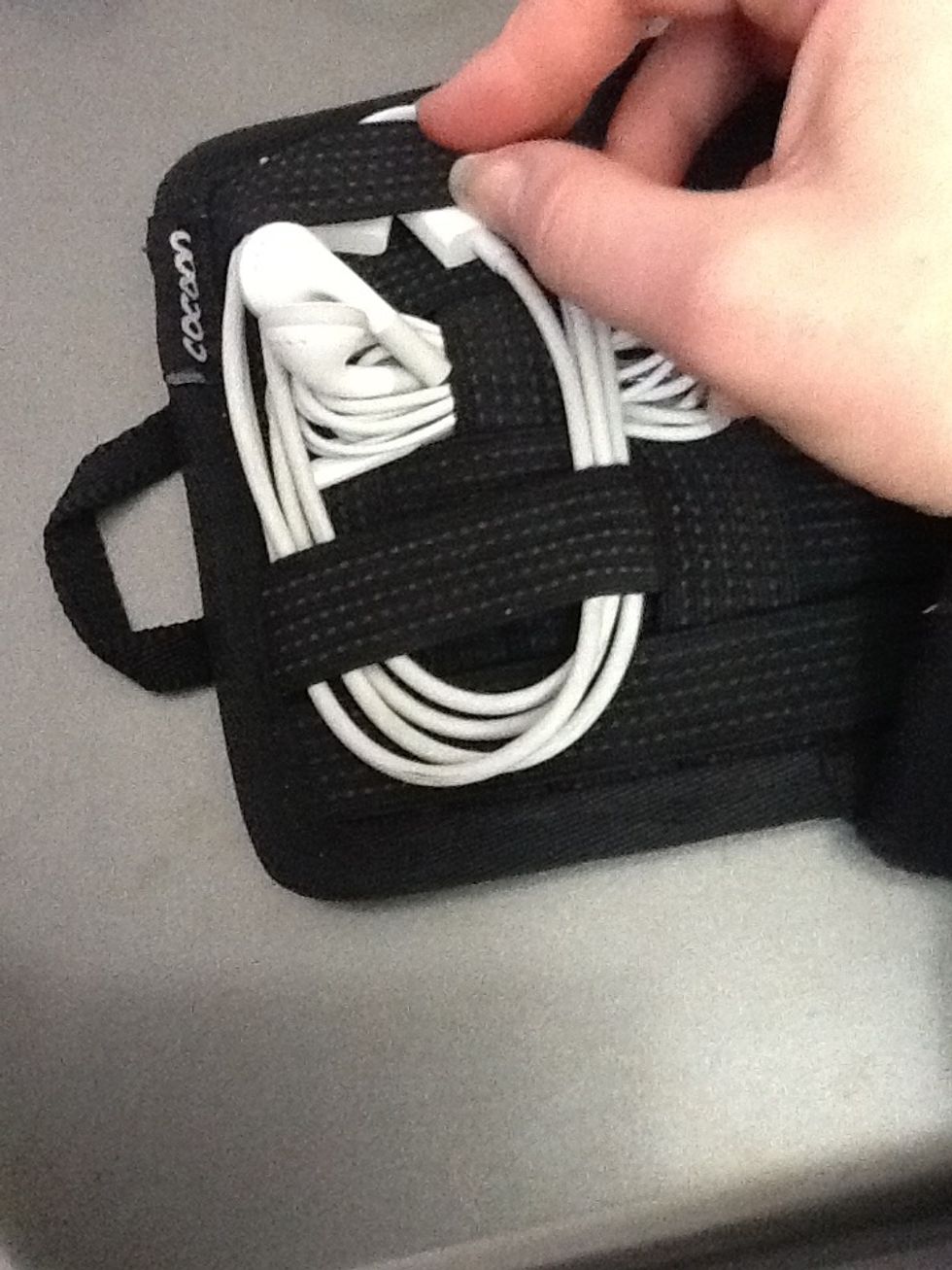 For longer cords, you can use two bands. Put the ends of the cords directly underneath a band to secure them.