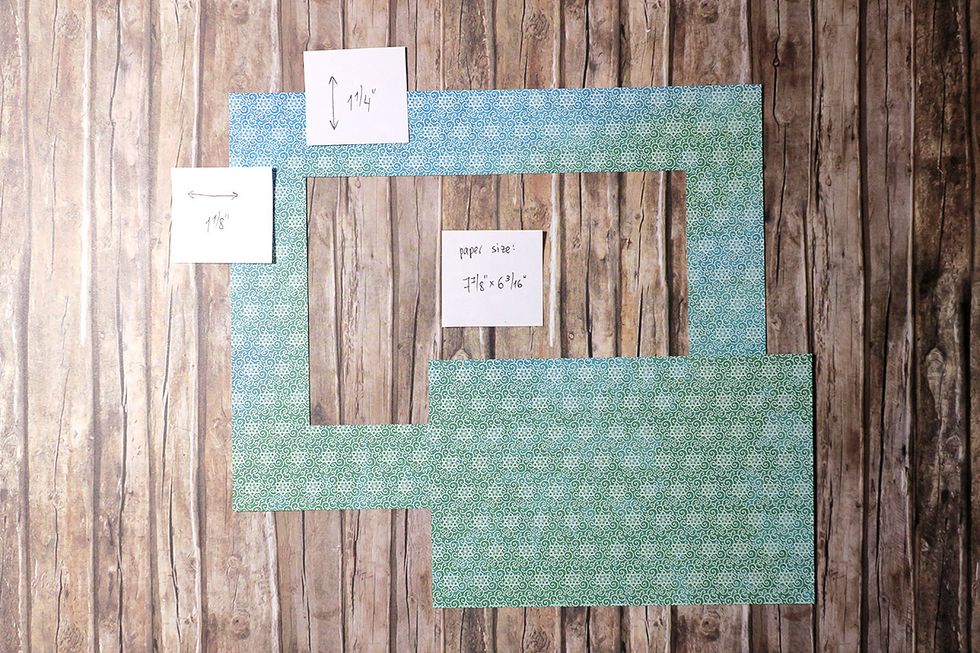 For matting the top of the box, you will need a piece of paper measuring 7 7/8" X 6 3/16". Draw 2 vertical guidelines 1 1/8" away from the edges, and 2 horizontal ones 1 1/4" away from the edges.